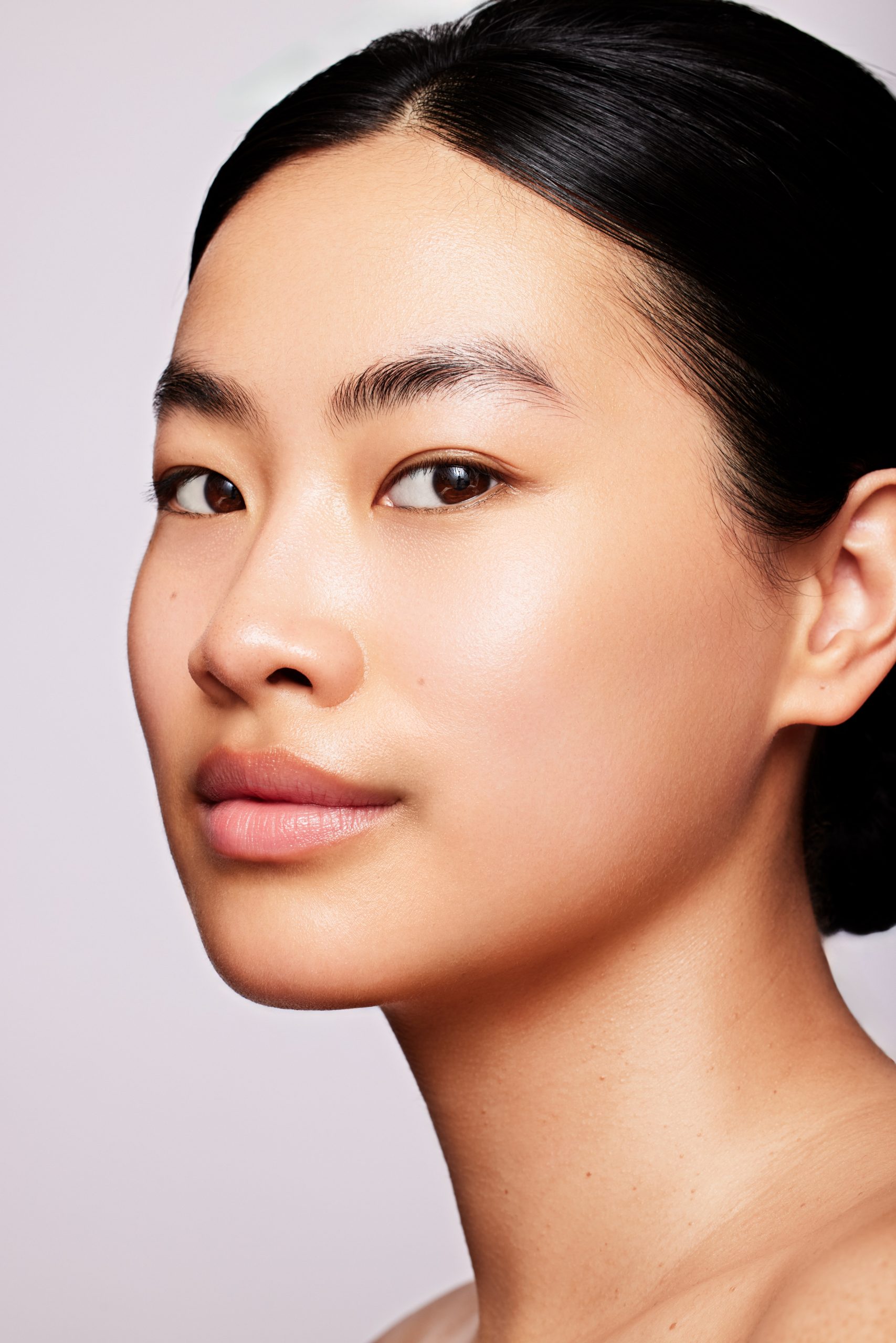 Clean beauty skincare portrait, model with natural glowing skin and no makeup look, skincare photography by Furkan Ramadani